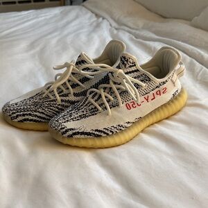 adidas Yeezys in Cream, Black, and Red